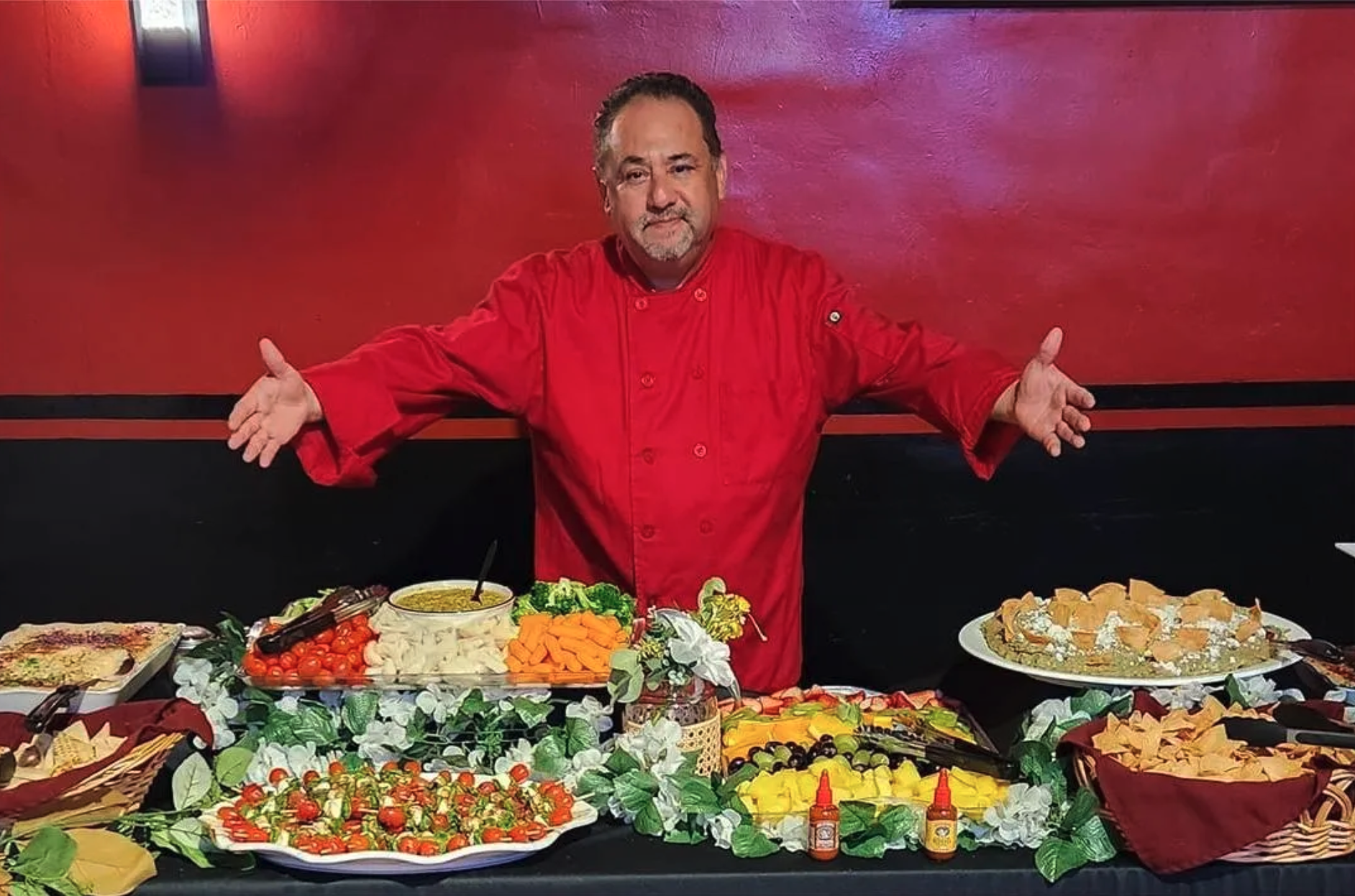 Chef Fitch presenting a vibrant Mexican catering spread